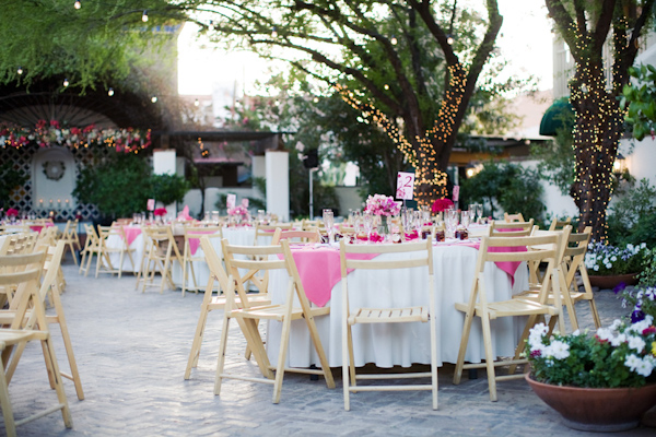 Outdoor reception seating with whimsicall lighting - wedding photo by